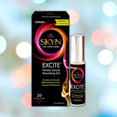 Image of a boxed product named "LifeStyles SKYN Excite Clitoral Stimulation Gel" by LifeStyles. The box next to the bottle displays colorful swirling graphics, promising to intensify sexual excitement and pleasure with ingredients like L-arginine and menthol. The bottle is silver with similar branding.
